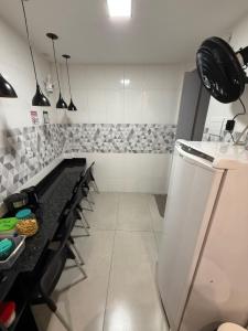 a kitchen with a counter and a counter top at 2367 Belém Residence in Belém