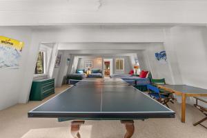 a living room with a ping pong table in it at Agate Bay Chalet in Carnelian Bay