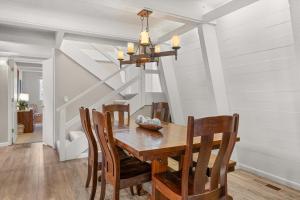 a dining room with a wooden table and chairs at Agate Bay Chalet in Carnelian Bay