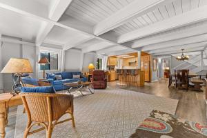 a living room with a blue couch and a table at Agate Bay Chalet in Carnelian Bay