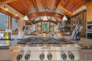 a kitchen with a stove top oven in a room at Stone Peak Lodge in Tahoe City