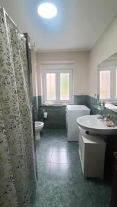 a bathroom with a tub and a sink and a toilet at Casa Pepe La Granda in Trasona +41 photos