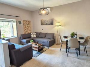 a living room with a couch and a table at Sogno 2 in Parga