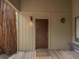 a front door of a house with a tree at Rooted Resort in Kings Beach