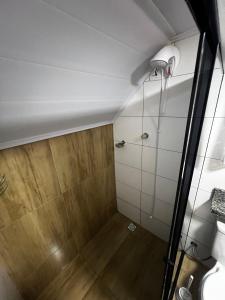 a bathroom with a shower and a toilet at Refúgio do Lago in Fraiburgo +51 photos