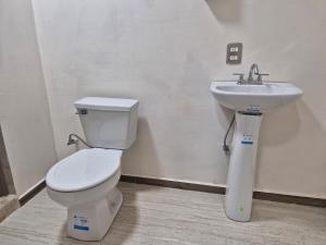 a bathroom with a toilet and a sink at Hermosa Suite Anakoba 6 in La Concha