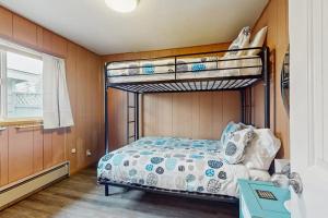 a bedroom with two bunk beds and a window at Oceanfront Beauty in Blaine