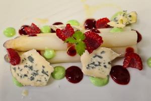 a plate of food with fruit on it at Auberge de l'Etoile in Vignory