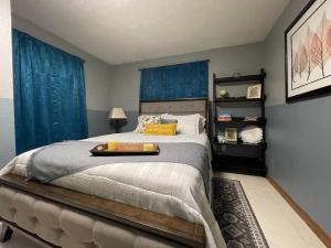 a bedroom with a bed with a tray on it at Cozy Little Dipper in North Pole