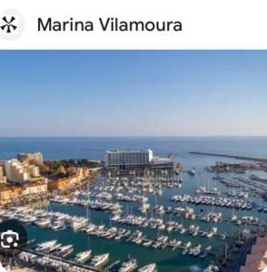 a marina in a city with boats in the water at Vilamoura -Boat in Quarteira