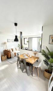a living room with a table and chairs and a couch at Nan Hotel Osaka in Osaka +33 photos