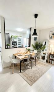 a kitchen and dining room with a table and chairs at Nan Hotel Osaka in Osaka