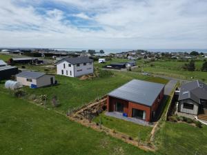 an overhead view of a small house on a green field at Rack n Relax Riverton in Riverton
