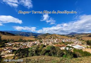 a town on a hill with mountains in the background at Studio Mara Alagoa in Alagoa +2 photos