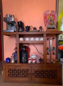 a wooden shelf with a coffee maker on it at Cómoda habitación para descanso, La casa del artista in Toluca