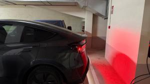 a black car parked in a garage with a parking lot at Oktheway Pedro Saco Street 2 in Sarria