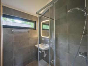 a bathroom with a sink and a shower at Cabin 22 in Zutendaal +32 photos