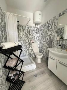 a bathroom with a toilet and a sink at Apartments by the sea Potocnica, Pag - 222 in Novalja