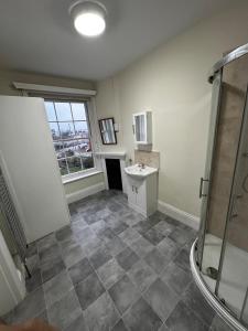 a bathroom with a shower and a sink at Two Perfect for large groups and secured free parking in Reading +20 photos