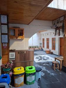 a room with trash cans and a table in a building at Ela Sultan Han Otel in Gaziantep +30 photos