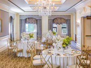 a banquet room with tables and chairs and a chandelier at Fairmont Royal York Hotel in Toronto +162 photos