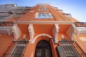 an orange building with windows and a door at Taxim in Istanbul