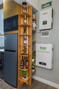 a kitchen with a refrigerator and a shelf at Aiidraproperties in Lagos