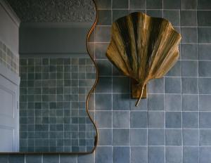 a umbrella on the wall of a bathroom at Sona Molong in Molong