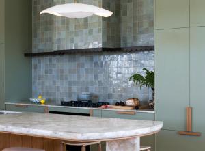 a kitchen with a marble counter top and a stove at Sona Molong in Molong