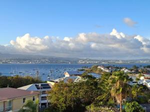 a view of a city with boats in the water at Studio vu sur les caraïbes in Les Trois-Îlets