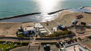 an aerial view of a beach with buildings and the ocean at Vista mare Fiumicino-Beach&Fly Stay in Fiumicino