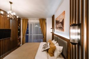 Llit o llits en una habitació de Eliss Studio Sinaia - spa si piscina contra cost 59 fotos més