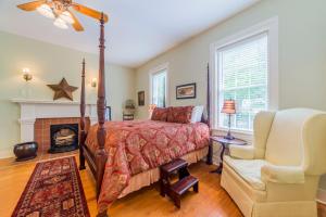 a bedroom with a bed and a fireplace at Bourbon Manor Bed & Breakfast Inn in Bardstown