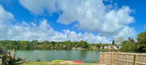 a lake with two boats on the shore at Mia Rose in South Daytona