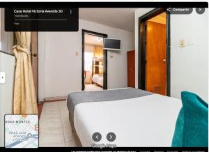 a hotel room with a bed in a room at CASA HOTEL VICTORIA Av 30 in Bogotá