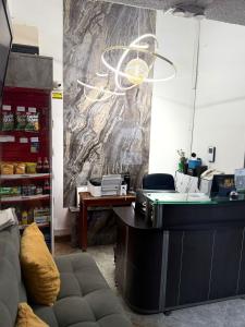 an office with a desk and a table at CASA HOTEL VICTORIA Av 30 in Bogotá