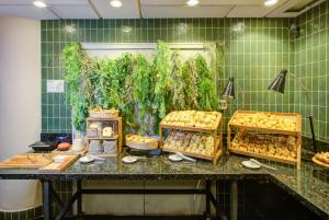 a buffet of food on a counter in a room at Park Inn by Radisson Berrini in São Paulo