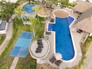 an overhead view of a swimming pool with a resort at Casa Parota in Naranjo