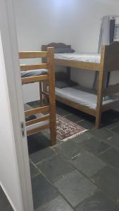 a doorway to a room with a bunk bed at Quarto para 4 hóspedes in Itu