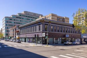 a building on a city street with a traffic light at Oaktown Roost in Oakland +12 photos