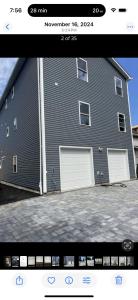 a picture of a house with two garage doors at Blessed Homes in East Orange