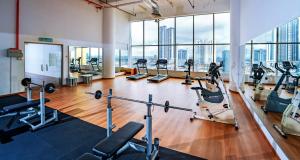 a gym with treadmills and cardio equipment in a building at New York Hotel in Johor Bahru