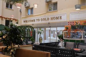 a restaurant with a sign that reads welcome to cold home at GoldHome Apart Otel in Famagusta