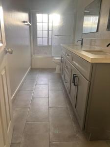 a bathroom with a sink and a toilet at KTown Sanctuary Soul in Los Angeles