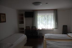 Postel nebo postele na pokoji v ubytování Pension Casa Topolino