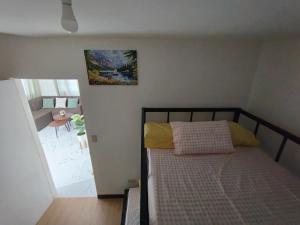 a bedroom with a bed and a view of a room at Sorelle Haven II in Manolo Fortich