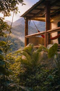 a house with a view of a mountain at Refugio Rio Santo in Las Alfombras