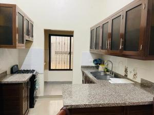 a kitchen with a sink and a counter top at Mi casita en Jaraba in Jarabacoa