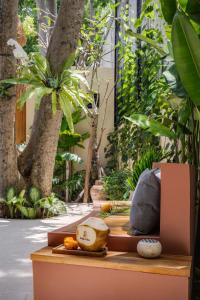 a table with plants on it in a garden at Bebas Suites - Uluwatu, Bali in Uluwatu