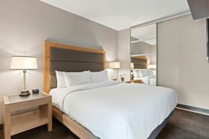 a large white bed in a hotel room at Group stay Pangasinan in Bugallon +5 photos